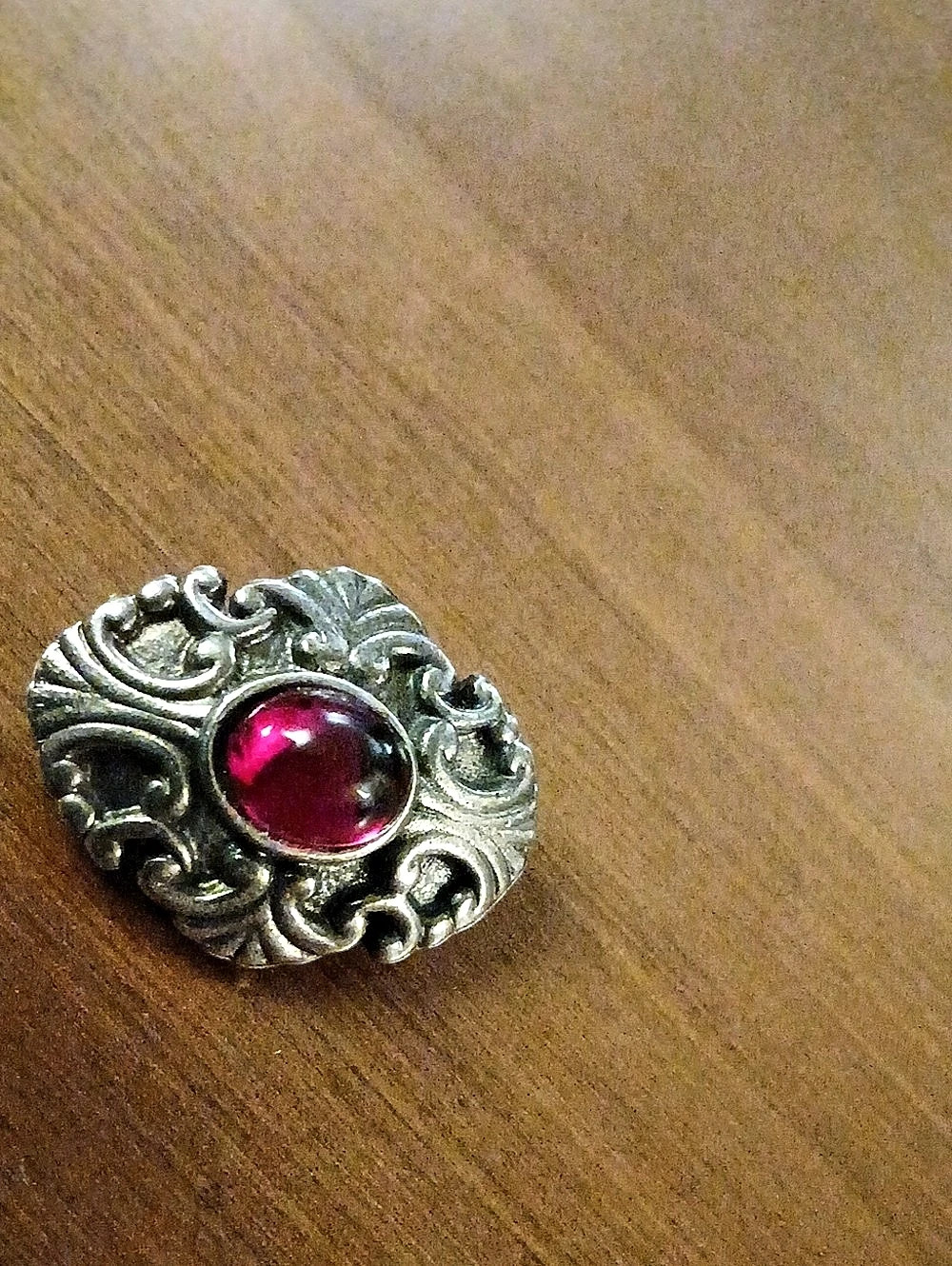 Ornate Red Stone Brooch in Silver Tone